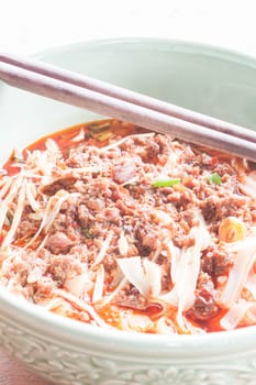 Close up spicy noodle in meat soup