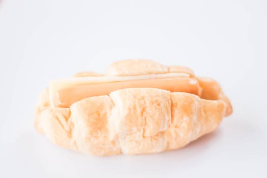 Sausage and cheese filling croissant on white background