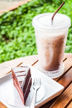 Refreshing break with cold coffee and chocolate cake