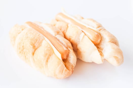 Croissants with sausage and cheese isolated on white background
