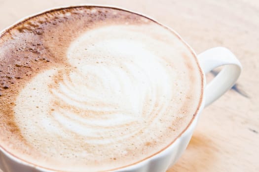Free pour hot coffee latte art cup up close