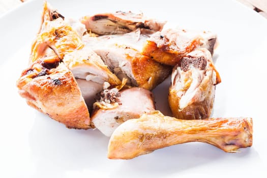 Grilled chicken on plate, stock photo