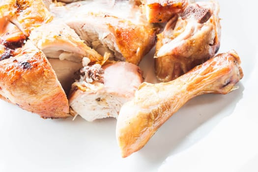 Homemade chicken grilled on plate, stock photo