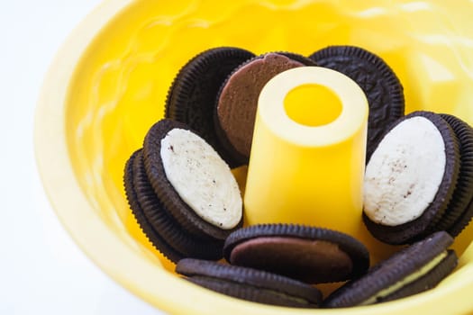Silicone cake form and cookies on white background, stock photo