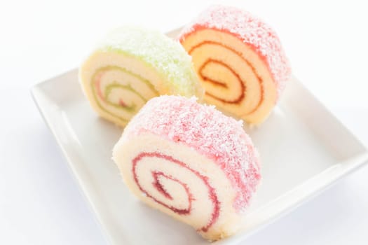 Colorful jam roll cakes  on the dish, stock photo