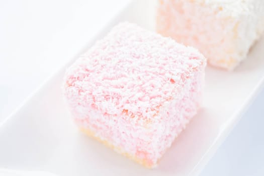 Lamington sponge cakes on the plate, stock photo