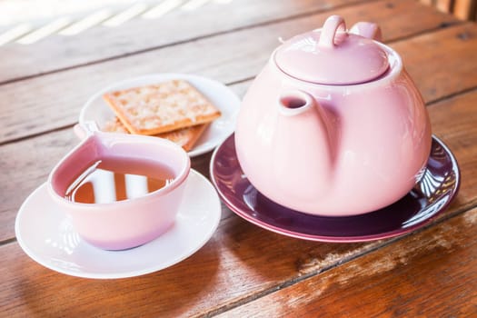 Hot cup of tea with teapot, stock photo