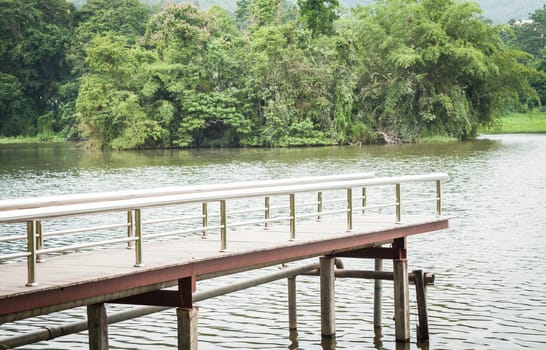 Metal bridge into the water, stock photo