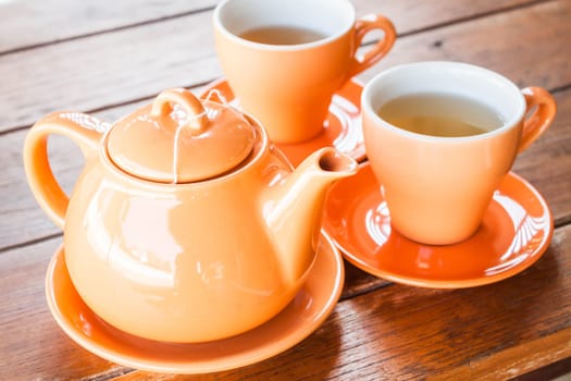 Set of hot cups and teapot, stock photo