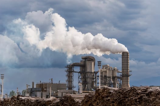 industrial scene with chimneys and stormy sky