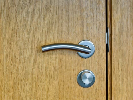 Modren style door handle on wooden door
