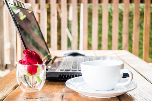Comfortable work station with laptop and coffee, stock photo