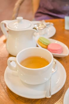 Set of hot tea with macaroon, stock photo