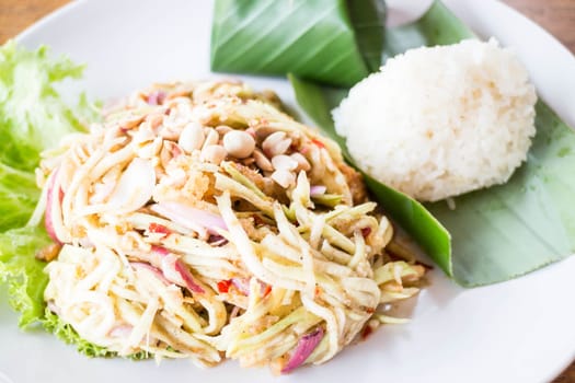 Mango spicy salad and sticky rice, stock photo