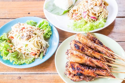 Spicy meal with papaya and mango salad, stock photo