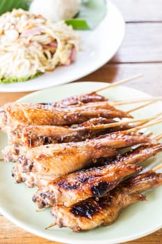 Grilled chicken serving with papaya salad, stock photo