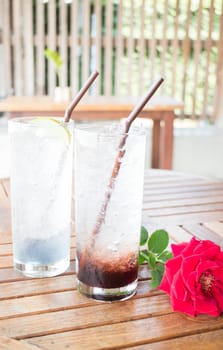 Cold herb drinks serving on wood table, stock photo