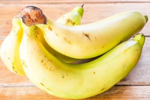 Bunch of bananas on wooden background, stock photo