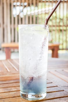 Iced lemon juice and butterfly pea herb drink, stock photo