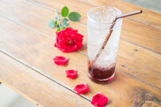 Serving pomegranate drink on wood table, stock photo