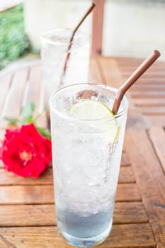 Iced herb drinks serving on wood table, stock photo