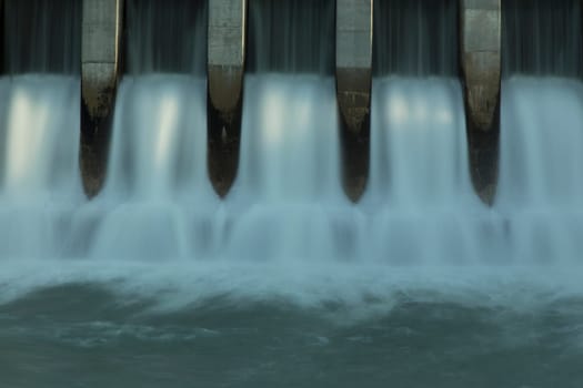 Close up time exposure of the spillway on the Kananaskis hydroelectric dam on the Bow River, Alberta, Canada