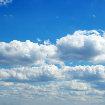 Blue sky background with tiny clouds