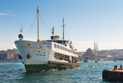 Ferry boat arriving at Karakoy pier in Istanbul. Nearly 150,000 passengers use ferries daily in Istanbul, due to easy access to two different continents.