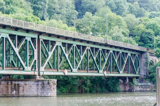 Old riveted steel bridge for train traffic over the Ruhr near Essen Kettwig