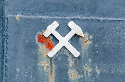 The symbol mallet and iron,here on a lore shows a close relationship to the mining anl.