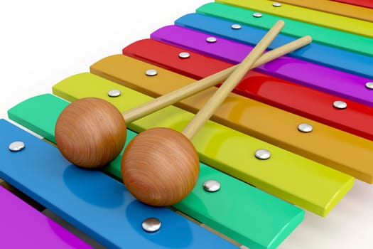 Colorful wooden xylophone with mallets, close-up image