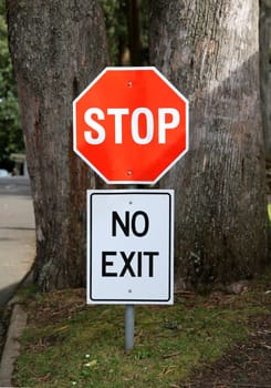 Stop and no exit signs prohibiting traffic