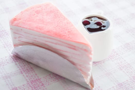 Delicious crepe cake and blueberry sauce, stock photo