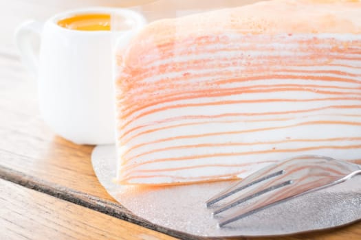 Close up crepe cake with orange sauce, stock photo