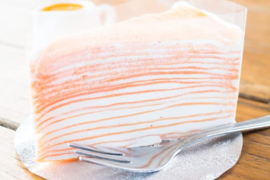 Delicious homemade crepe cake with orange sauce, stock photo