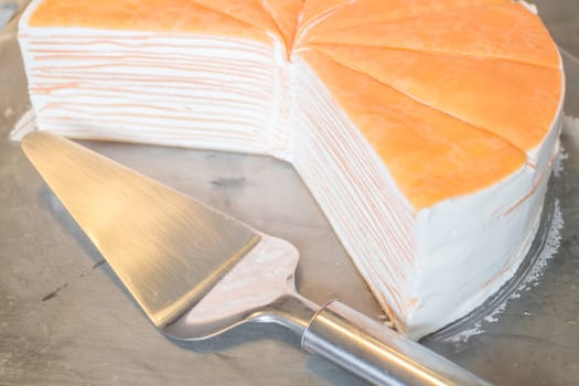 Orange whipped cream crepe cake, stock photo