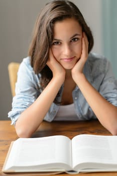 Teenage girl enjoy reading book student at home