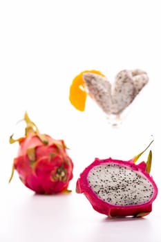 The dragonfruit has a blazing white pulp,a vibrant violet,leathery skin and a mild aroma reminiscent of the kiwi fruit. Serve chilled as a refreshing desert..