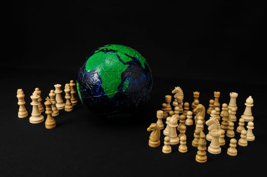 Globe And White Chess on a Black Background