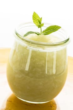 Cold bowl with melon and mint in glass