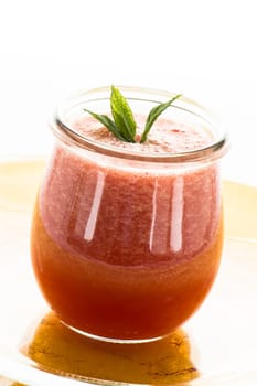 Red cold bowl with watermelon and mint in glass