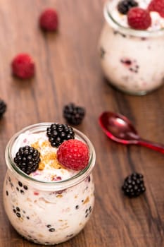 Raspberries and blackberries with high-format yoghurt