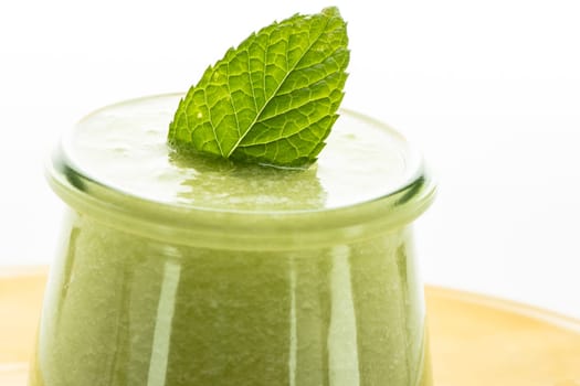 Cool cold bowl with melon and peppermint in the glass