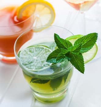 Cocktails and longdrinks garnished with fruits for summer