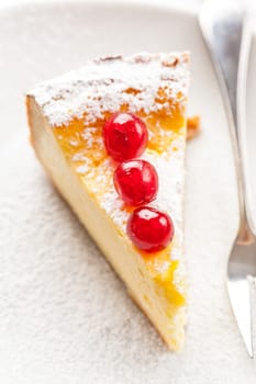 Cheesecake decorated with sweet cherries