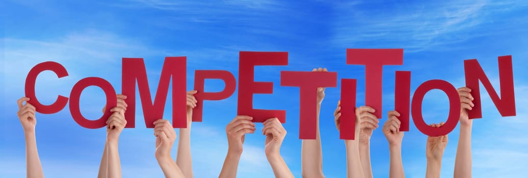 hands holding four pieces of a puzzle with copy space, gray background
