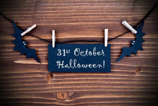 Black Label on a Line with the Words 31st Ocotber Halloween on wooden Background