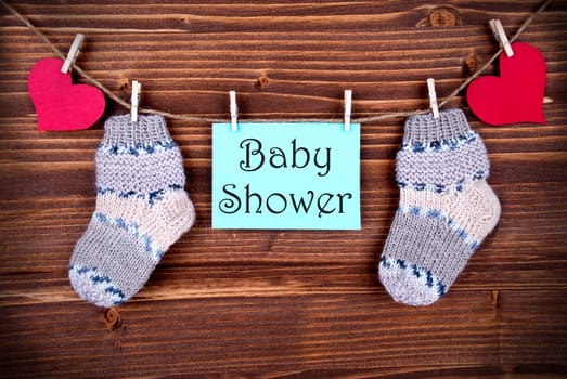 The Words Baby Shower on a Blue Label with Socks and Hears on a Line