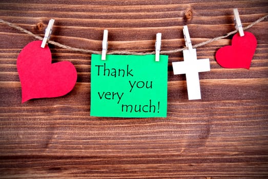 Greent Tag with Hearts and Cross on a Line with the Words Thank You Very Much
