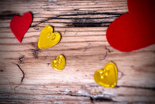 Lovely Heart Background with many Different Hearts on an Old Wooden Plank